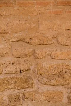 Brick texture old vintage background. Dirty aged and rust stone surface facade. Stock Photos