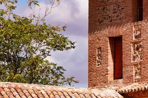 Brick Tower and Clay Tile Roof of Las Virtudes Sanctuary Stock Photos