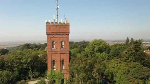 Brick tower and surrounding trees and houses Video stock 160998719