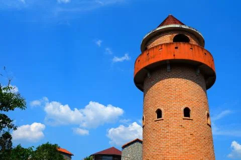 Brick Tower with Blue Sky Background. Foto stock