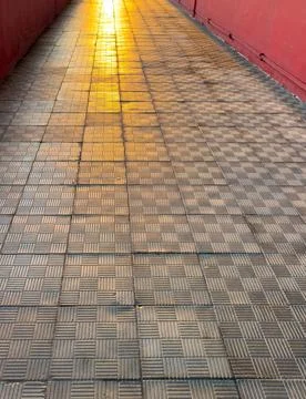 A brick walkway with a checkered pattern Stock Photos