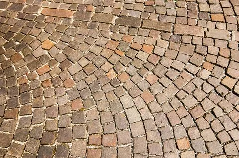 A brick walkway with a pattern of squares and triangles 스톡 사진