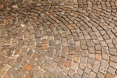 A brick walkway with a pattern of squares 스톡 사진