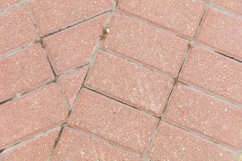 A brick walkway with a pattern of squares Stock Photos