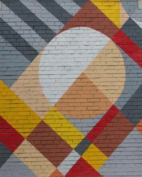Brick wall with an abstract geometric pattern. Stock Photos