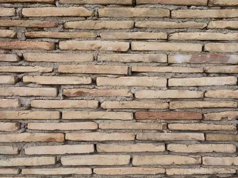 Brick wall aesthetics, Closeup of aged brick wall showing layered terracott.. Stock Photos