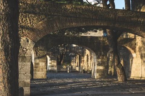 Brick wall and columns as part of the Saint George's Castle in Lisbon, Portugal Stock Photos