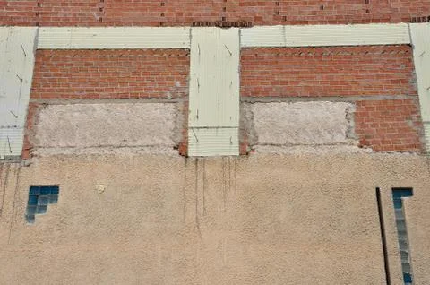 Brick wall and insulation material Stock Photos