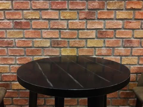 Brick wall and table 스톡 사진