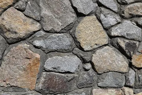 Brick wall background. Abstract pattern of rocks. Stock Photos