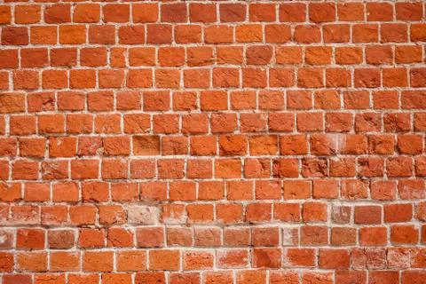 Brick wall background. Ancient red brick wall. Texture, wallpaper. Stock Photos