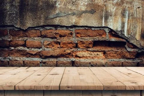 Brick wall background and empty wooden table display montage for product with Stock Photos