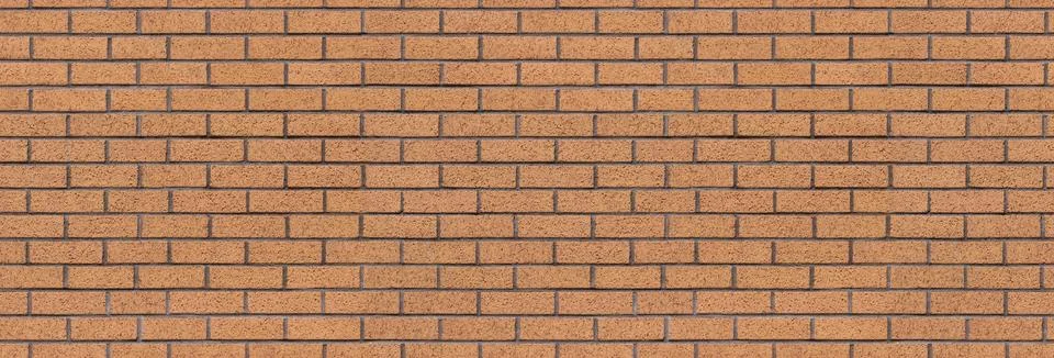 Brick wall background – brickwall building backdrop with brown stone blocks Фото