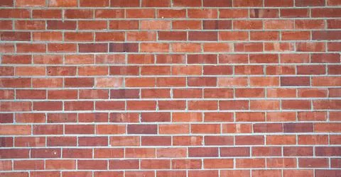 Brick wall background. Brickwall for texture or backdrop. Old brick wall of an Stock Photos