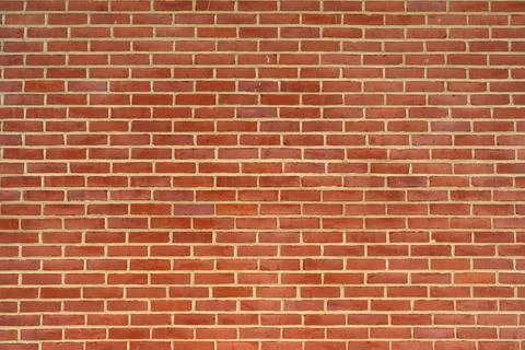 Brick wall background. Brickwall for texture or backdrop. Brick on building wall Stock Photos