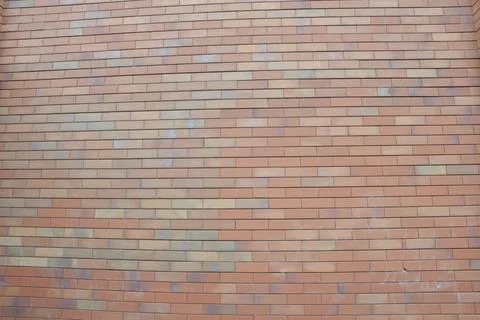 Brick wall. Background. Decorative facing brick. Modern finishing building ma Stock Photos