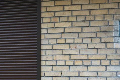 Brick Wall Background with Metal Shutter and Copy Space Stock Photos