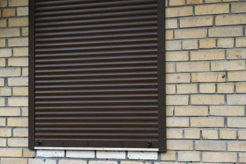 Brick Wall Background with Metal Shutter and Copy Space Stock Photos