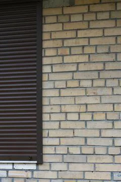 Brick Wall Background with Metal Shutter and Copy Space Stock Photos