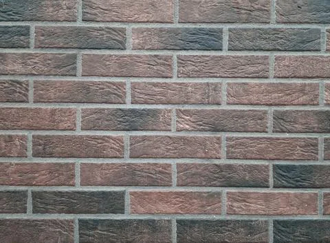 Brick wall background, red and black bricks, wall facing, decorative brick .. Stock Photos