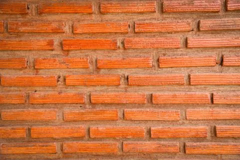 Brick wall background / red brick with cement concrete plaster on wall textur Foto stock