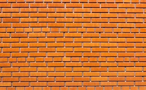 Brick wall as background. Red brick wallpaper. Stock Photos