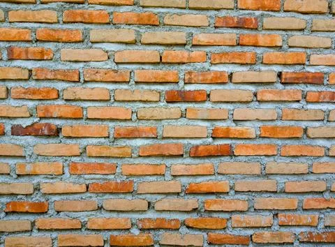 Brick wall background in soft-focus in the background Stock Photos
