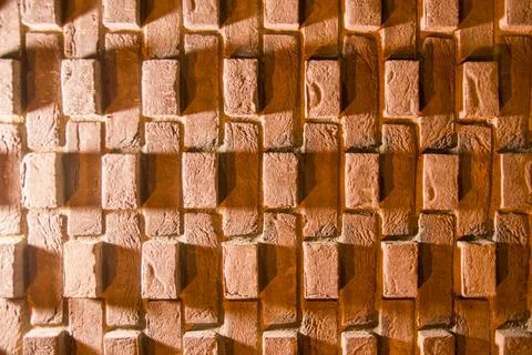 Brick wall background with soft shadows illuminated from left side Stock Photos