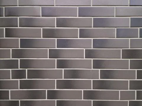 Brick wall background, wall facing, decorative brick tiles Stock Photos
