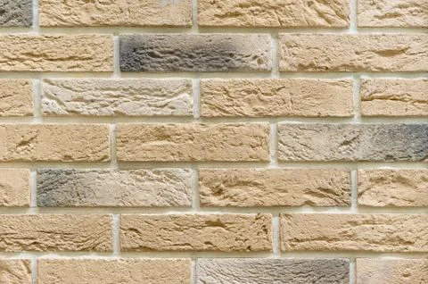 Brick wall of beige bricks. Background and texture of brickwork. Foto stock