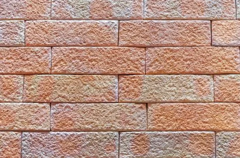Brick wall of beige bricks. Background and texture of brickwork. Stock Photos