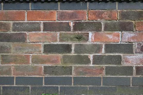 A brick wall with a black border Stock Photos