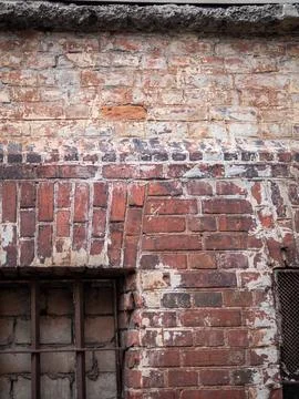 Brick wall with blocked window of old building Stock Photos