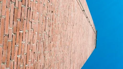 Brick wall blue sky Stock Photos