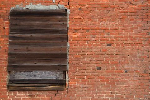 Brick wall boarded window Stock Photos