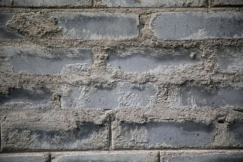Brick wall. Brick texture. Brick background. The process of making a concrete Stock Photos