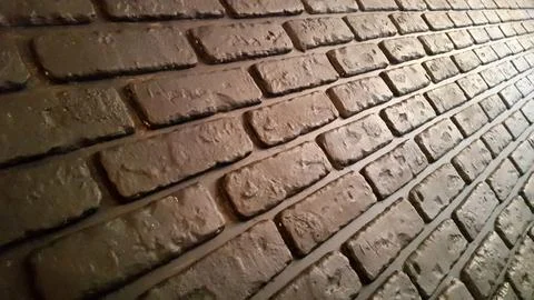 Brick wall. Bricks. Dirty brick surface. Vintage background for postcards Stock Photos