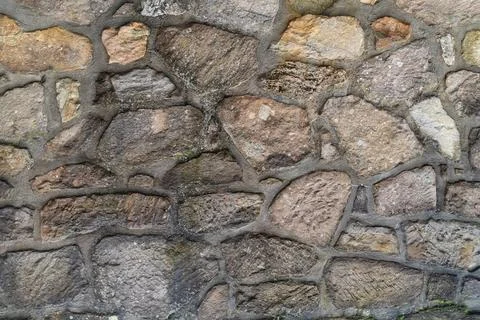 Brick wall brown brick with gray cement lines close up Stock Photos
