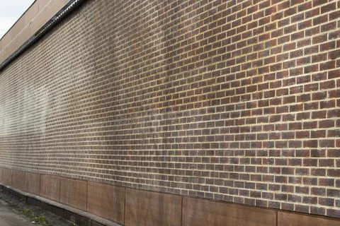 A brick wall in the building. A solid wall with no windows. Foto stock