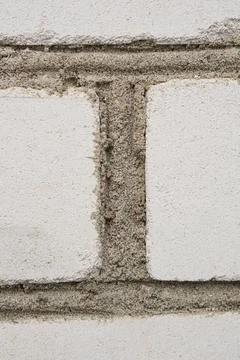 Brick wall with cement, close-up. Background Stock Photos