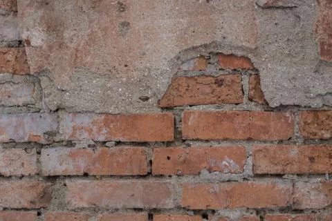 Brick wall with cement coating. Stock Photos