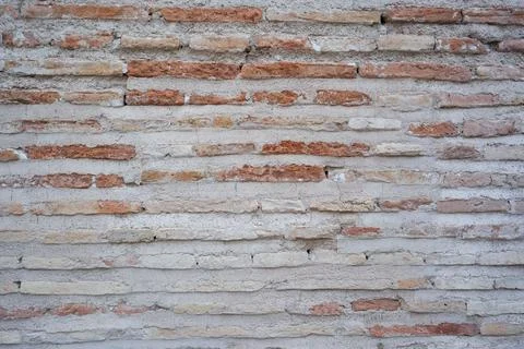 Brick wall with cement of an old construction Stock Photos