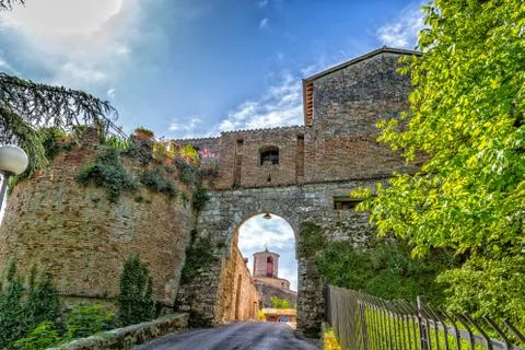 Brick wall clock tower  view through arch Stock Photos