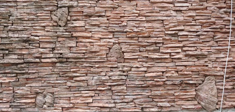A brick wall of coarse red brick Stock Photos