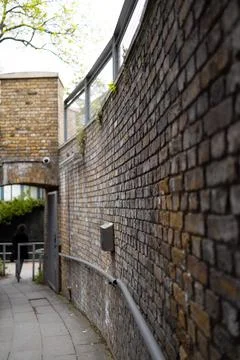 Brick wall corridor Stock Photos
