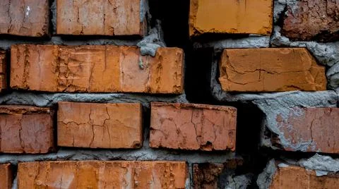 Brick wall with crack, wall background, texture. The concept of the old house Stock Photos
