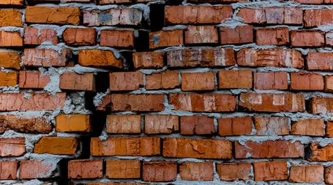 Brick wall with crack, wall background, texture. The concept of the old house Stock Photos