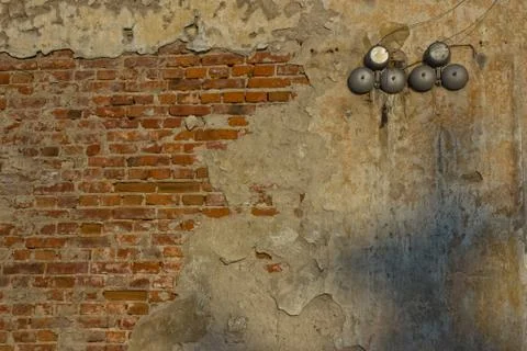Brick wall with damage and shooting and siren Stock Photos