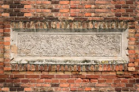 The brick wall with decorative plaster Stock Photos