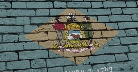 A brick wall with the delaware state flag of the United States of America Stock Footage 337428019